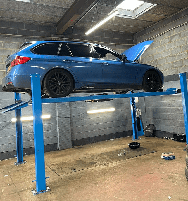 Blue vehicle up on a ramp - Tyres Prudhoe