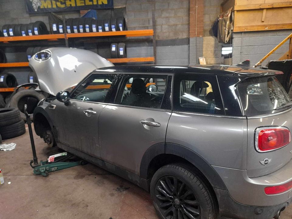 Stationary vehicle with its bonnet up - Car Repairs Prudhoe
