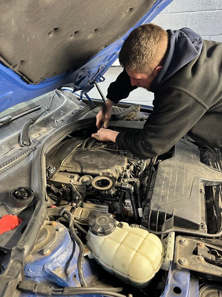 Mechanic from Prudhoe Tyres checking a vehicle engine - Tyres Prudhoe
